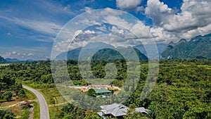Aerial landscape view of Mulu village with road, tropical forest and mountains near Gunung Mulu national park. Borneo. Sarawak.