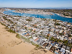 Aerial landscape view of Newport Beach, California homes, buildings and waterways