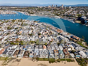 Aerial landscape view of Newport Beach, California homes, buildings and waterways