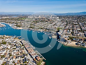 Aerial landscape view of Newport Beach, California homes, buildings and waterways