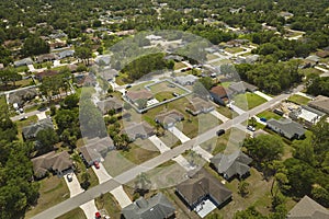 Aerial landscape view of suburban private houses between green palm trees in Florida quiet rural area