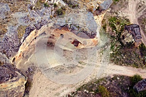 Aerial landscape view of typical geologic formations in Cappadocia. View of hill with abandoned cave houses