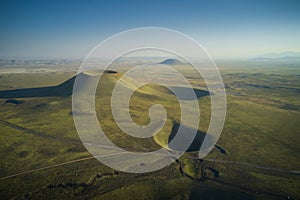 Aerial landscape of volcanic crater in Turkey. Stunned view of green valley with mountains and crater lake