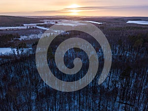 Aerial landscape with winter in european forest and field