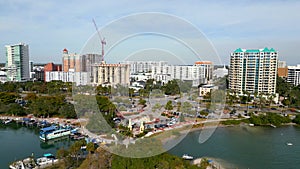 Aerial lateral motion video Sarasota bayfront scene with yachts and condominiums