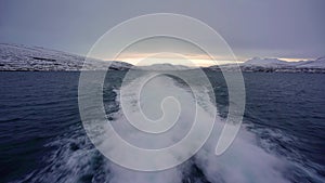 Aerial-like shot of the sea from a boat in Akureyri, Iceland