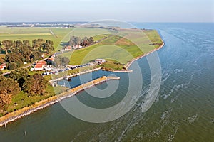 Aerial from the little old village and harbor from Laaxum at the IJsselmeer in the Netherlands