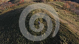 Aerial little planet view of people in autumn landscape from a drone