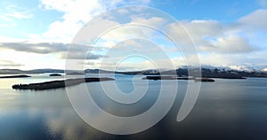 Aerial: Loch Tay in the Scottish Highlands during a clear winters day with snow on Ben Lawers, Scotland