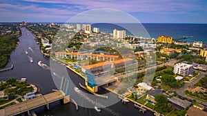 Aerial look north of intracoastal, drawbridge and pier over Deerfield Beach, FL