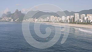 Aerial, low altitude view of Rio de Janeiro beaches in the summer time