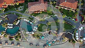 Aerial of Luxury hotel swimming pool at holiday resort, birds eye view