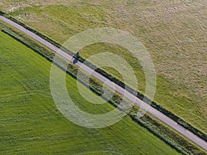 Aerial of meadowland separated by straight bicycle lane on the dutch island of Texel photo