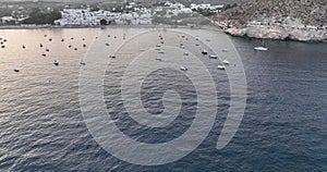 Aerial of many boats and seaside village Agua Amarga on in Cabo de Gata-Nijar natural park, Spain