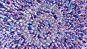 Aerial of many people. People crowd texture view above.