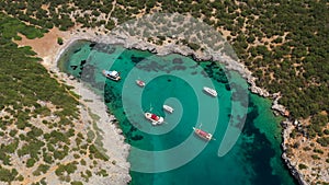 Aerial mediterranean sea landscape with sailing boat, yachts, turquoise clear water and bay coastline