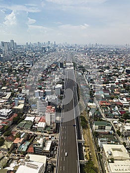 Aerial of the Metro Manila Skyway, a large elevated highway in Metro Manila cutting through the megacity photo