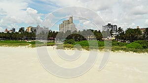 Aerial Miami Beach lifeguard tower to Lummus Park slow motion