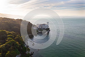 Aerial of the Miramare Castle in the scenic Gulf of Trieste in Italy captured on a bright day