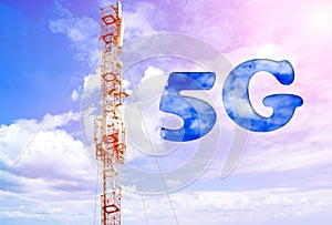 Aerial of mobile communication on a background of a blue cloudy sky. High antenna. Sun rays and glare. The inscription is 5G.