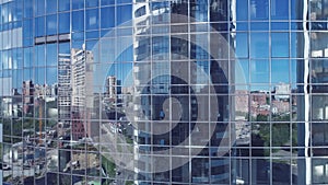 Aerial. modern business center. reflection of a megacity in the windows of a corporate building.