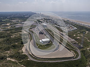 Aerial of motor sport race track with the north sea beach and the village of Zandvoort in the Netherlands