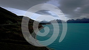 Aerial Of Mount Cook Pulling Back Over Turquoise Water Glacier Lake On Cloudy Day
