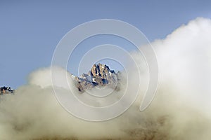 Aerial of Mount Kenya, Africa with snow and white puffy clouds in January, the second highest mountain at 17,058 feet or 5199 Mete