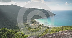 Aerial mountains island lagoon. Ocean view timelapse cloud sunset. Coast paradise beach with boat