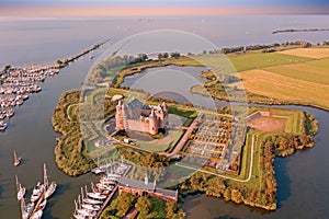 Aerial from Muiderslot castle at the IJsselmeer in the Netherlands at sunset