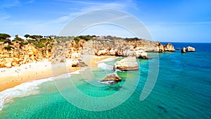 Aerial from natural rocks at Praia Tres Irmaos Alvor Portugal photo