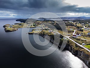 Aerial Newfoundland East Coast with homes on high cliffs near Skerwink Trail