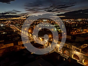 Aerial Night Panorama of Chihuahua City and Historic Aqueduct