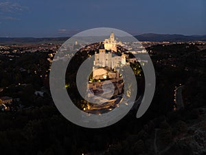 Aerial night panorama of illuminated Segovia old town historic centre Alcazar castle palace in Castile and Leon Spain