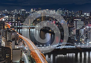 Aerial night panoramic view of Sumida river in Tokyo.