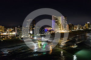 Aerial night photo Myrtle Beach fishing pier and hotel condominiums