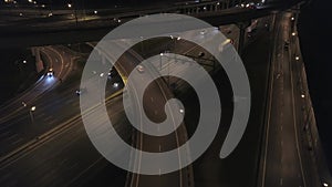 Aerial: Night Road Traffic on Freeway Interchange. 4K.