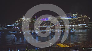 The aerial night scape shot of the port of Funchal. Cruise passenger ships with the lights around it. One of the cruise