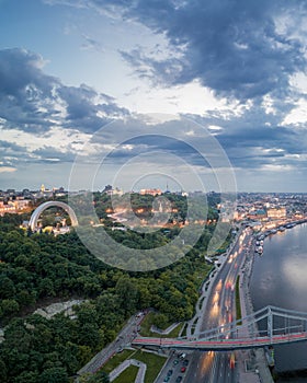 Aerial night view of the city of Kiev near the pedestrian bridge.