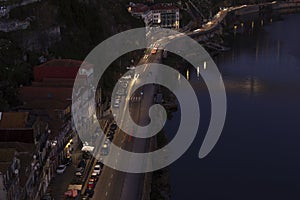 Aerial night view of the city traffic lights and the river in the city of Porto, Portugal.