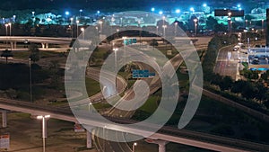 Aerial night view of empty highway and interchange without cars in Dubai