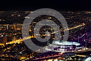 Aerial night view of Melbourne Cricket ground and city at night