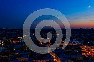 Aerial night view of old town of Lviv in Ukraine. Lvov cityscape. View from tower of Lviv town hall