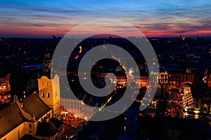 Aerial night view of old town of Lviv in Ukraine. Lvov cityscape. View from tower of Lviv town hall