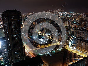 Aerial night view of one of the Central Park towers in the city of Caracas, Venezuela photo