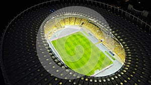 Aerial night view of Soccer stadium in downtown Kyiv, Ukraine. Tourism landmark of city. Soccer field. Football stadium