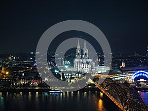 Aerial night view of St Peter Cathedral and Hohenzollern Bridge