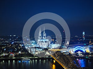 Aerial night view of St Peter Cathedral and Hohenzollern Bridge