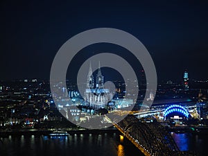 Aerial night view of St Peter Cathedral and Hohenzollern Bridge