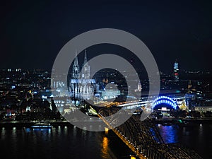 Aerial night view of St Peter Cathedral and Hohenzollern Bridge